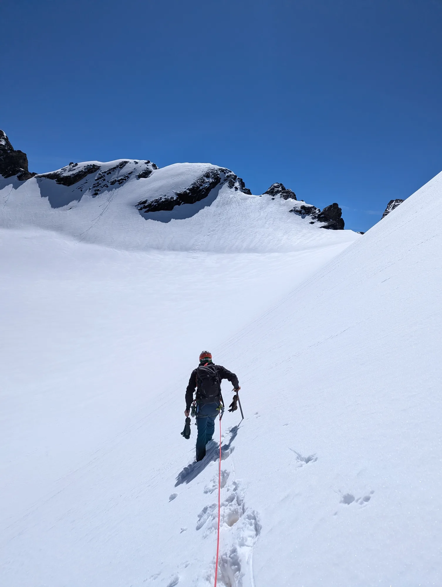 Breaking season trail on Oeschinen glacier from Fründenhütte towards Blüemlisalphorn. The normal ridge remains blocked and instead we climb straight through South wall